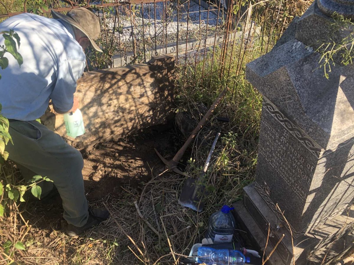 5. Struggling with the overturned gravestone of Eleanor Emma Elizabeth WRIGHT