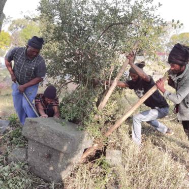 08. Unearthing a toppled gravestone