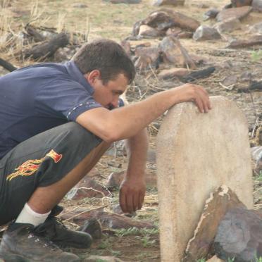 3. Willie Karsten trying to decipher the gravestone